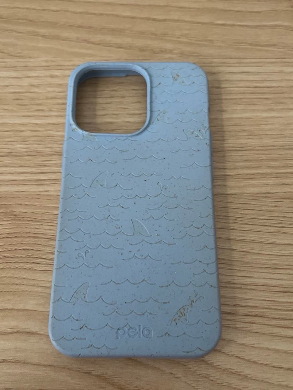 Blue Pela recyclable iPhone 13 Pro phone case with shark fin engravings
